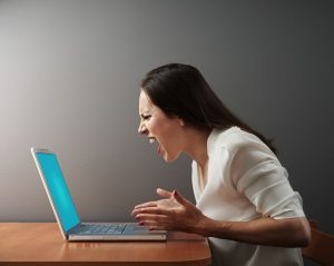 screaming angry woman with laptop